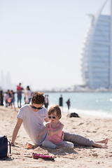 Image showing Mom and daughter on the beach