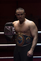 Image showing kick boxer with his championship belt