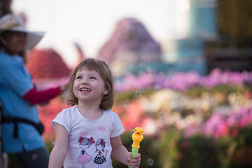 Image showing little girl with a doll