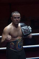 Image showing kick boxer with his championship belt