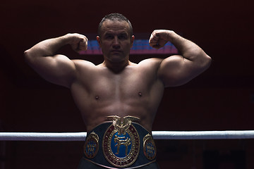 Image showing kick boxer with his championship belt