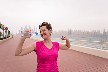 Image showing young woman celebrating a successful training run