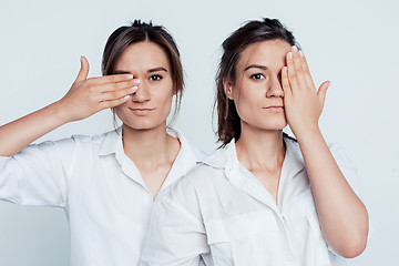 Image showing Studio portrait of female twins