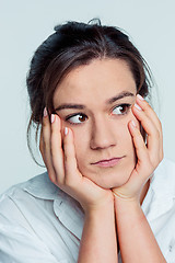 Image showing The young woman\'s portrait with thoughtful emotions