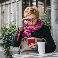 Image showing Adult woman surfing phone