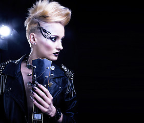 Image showing Fashion Rocker Style Model Girl Portrait. Hairstyle. Punk Woman Makeup, Hairdo and black Nails. Smoky Eyes