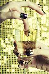 Image showing beauty close up photo fingers with manicure holding glass of champagne