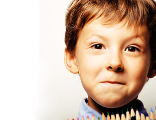 Image showing little cute boy with color pencils close up smiling, education f