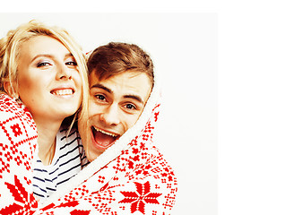 Image showing young pretty teenage couple at Christmas time warming in red dec