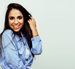 Image showing young happy smiling latin american teenage girl emotional posing on white background, lifestyle people concept