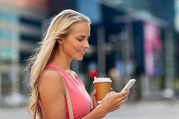 Image showing woman with coffee and smartphone in city