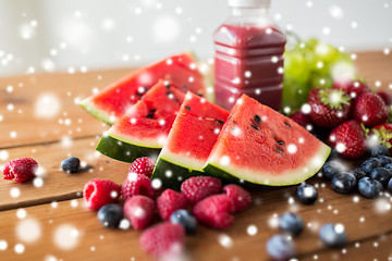 Image showing watermelon, bottle of fruit juice and berries