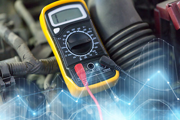 Image showing multimeter or voltmeter testing car battery