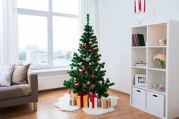 Image showing artificial christmas tree and presents at home