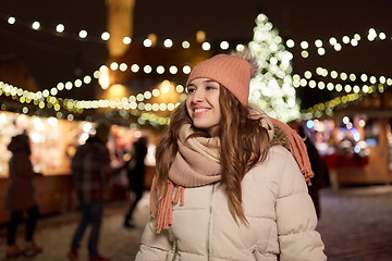 Image showing happy young woman at christmas market in winter