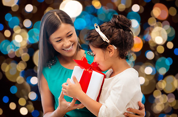 Image showing happy mother and daughter girl with gift box