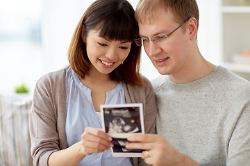 Image showing close up of happy couple with baby ultrasound