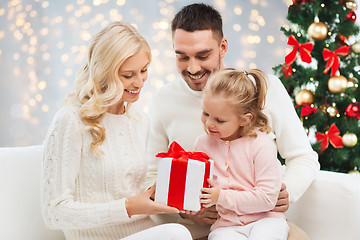 Image showing happy family at home with christmas gift box