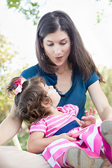 Image showing Mixed Race Mother and Cute Baby Daughter Playing with Cell Phone