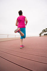 Image showing woman busy running on the promenade