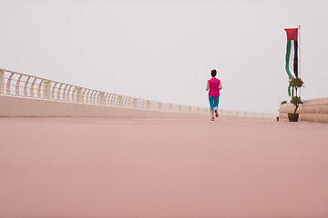 Image showing woman busy running on the promenade