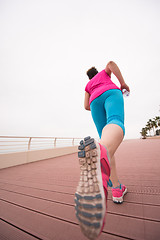 Image showing woman busy running on the promenade