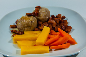 Image showing Potato dumplings, traditional Norwegian food with accessories