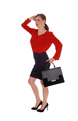 Image showing Business woman walking with black purse