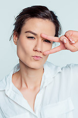 Image showing The young woman\'s portrait with thoughtful emotions