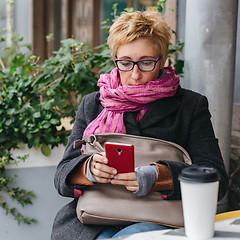 Image showing Adult woman surfing phone