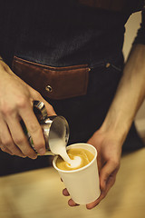 Image showing Bartender pouring coffee to cup