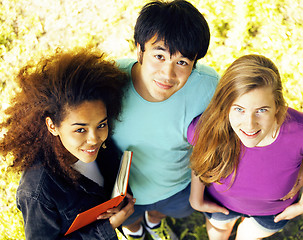 Image showing cute group of teenages at the building of university with books huggings, diversity nations