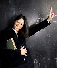 Image showing portrait of happy cute student at blackboard