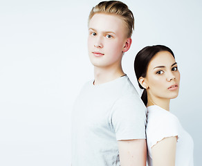 Image showing best friends teenage girl and boy together having fun, posing emotional on white background, couple happy smiling, lifestyle people concept, blond and brunette multi nations 