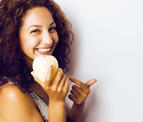 Image showing pretty young real tenage girl eating apple close up smiling