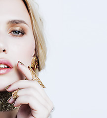 Image showing young pretty blond woman in luxury jewelry, lifestyle rich people concept closeup