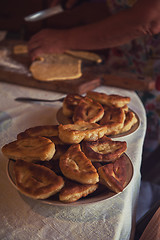 Image showing Grandmother bakes pies