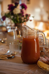 Image showing Decorated table with jug of juice