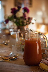 Image showing Decorated table with jug of juice