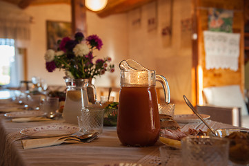 Image showing Decorated table with jug of juice