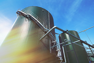 Image showing Industrial zone, Steel pipelines and valves against blue sky