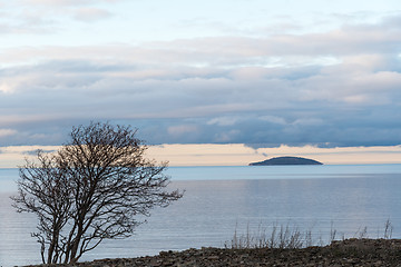 Image showing Solitude blue island in calm water