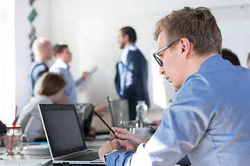 Image showing Relaxed informal IT business startup company team meeting.