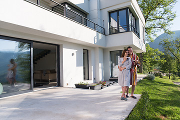 Image showing Young beautiful couple in bathrobes