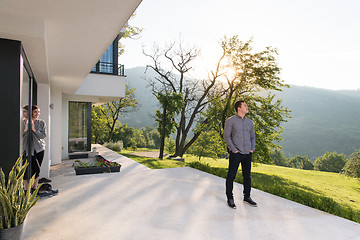 Image showing man in front of his luxury home villa