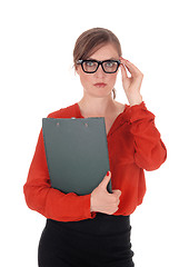 Image showing Business woman with glasses holding folder