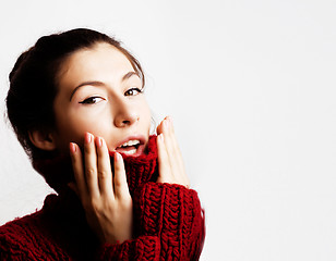 Image showing young pretty woman in sweater and scarf all over her face, lifes
