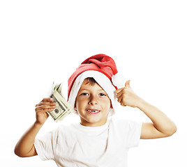 Image showing little cute boy in santas red hat isolated with cash american dollars