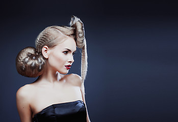 Image showing young elegant woman with creative hair style leopard print