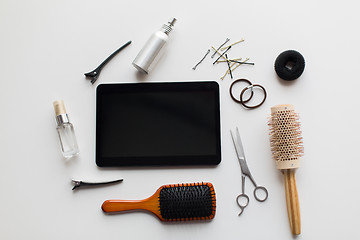 Image showing tablet pc, scissors, brushes and other hair tools